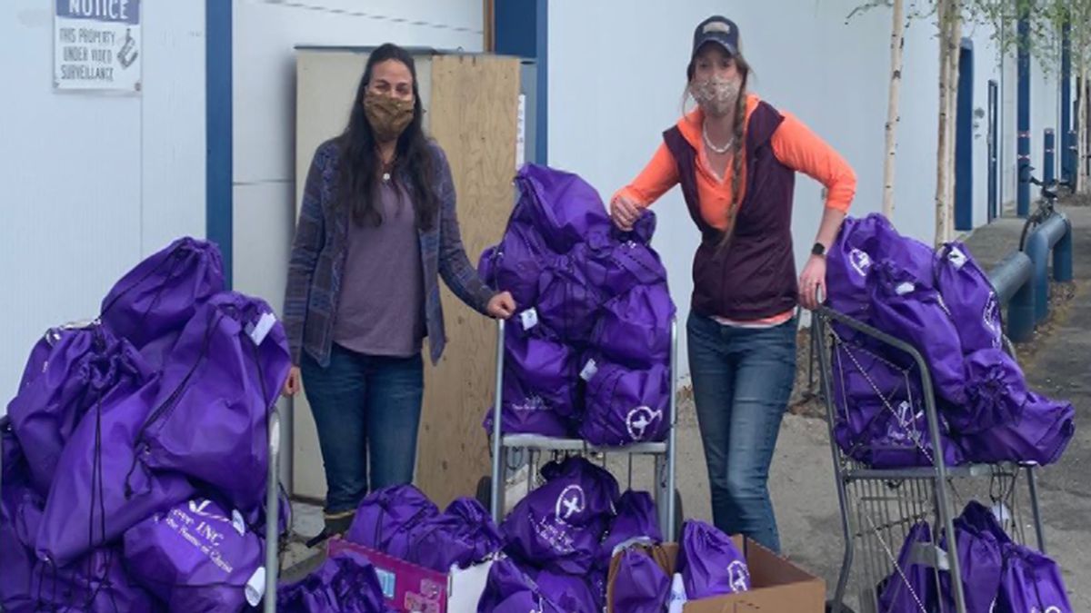 Volunteers from Love INC hand out toiletry bags to those in need.