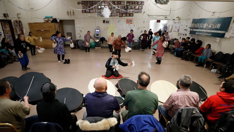 FILE - People take part in an Alaska Native dance Jan. 20, 2020, in Toksook Bay, Alaska, a...