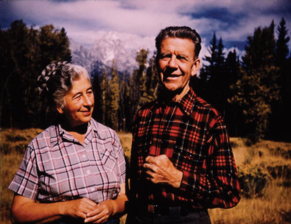 Mardy Murie (left) and Olaus Murie (right) by their home in front of Grand Tetons, 1953.
